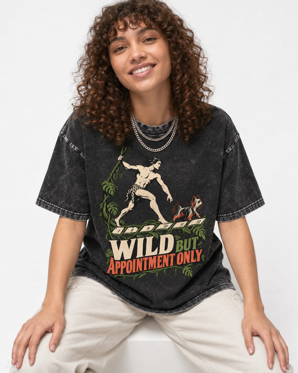 Yorkshire Terrier Wild but Appointment Only Jungle Calendar Graphic Washed Tee in Black, worn by a seated model