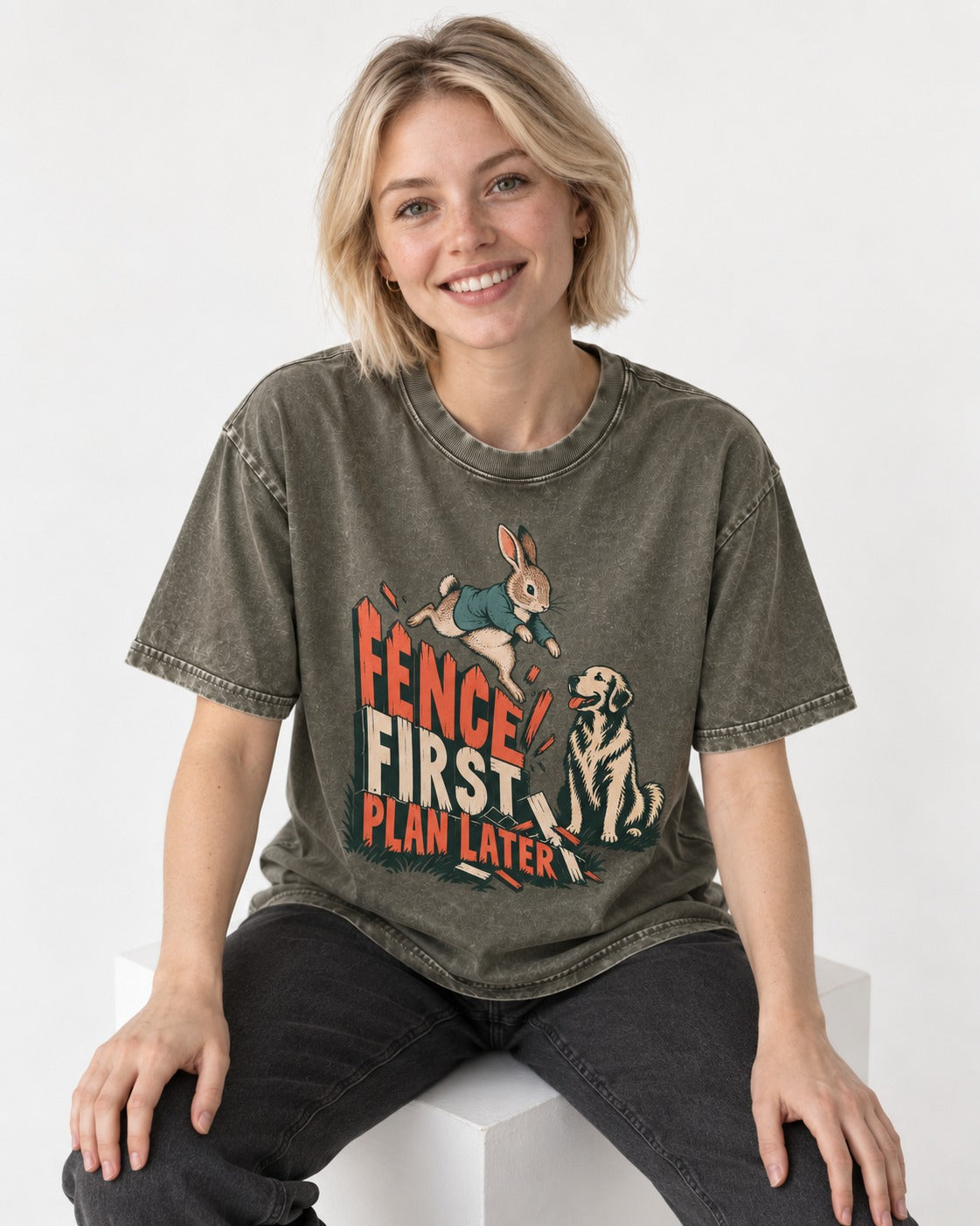 Golden Retriever Fence First Plan Later Rabbit Jump Graphic Washed Tee in Army Green, worn by a seated model