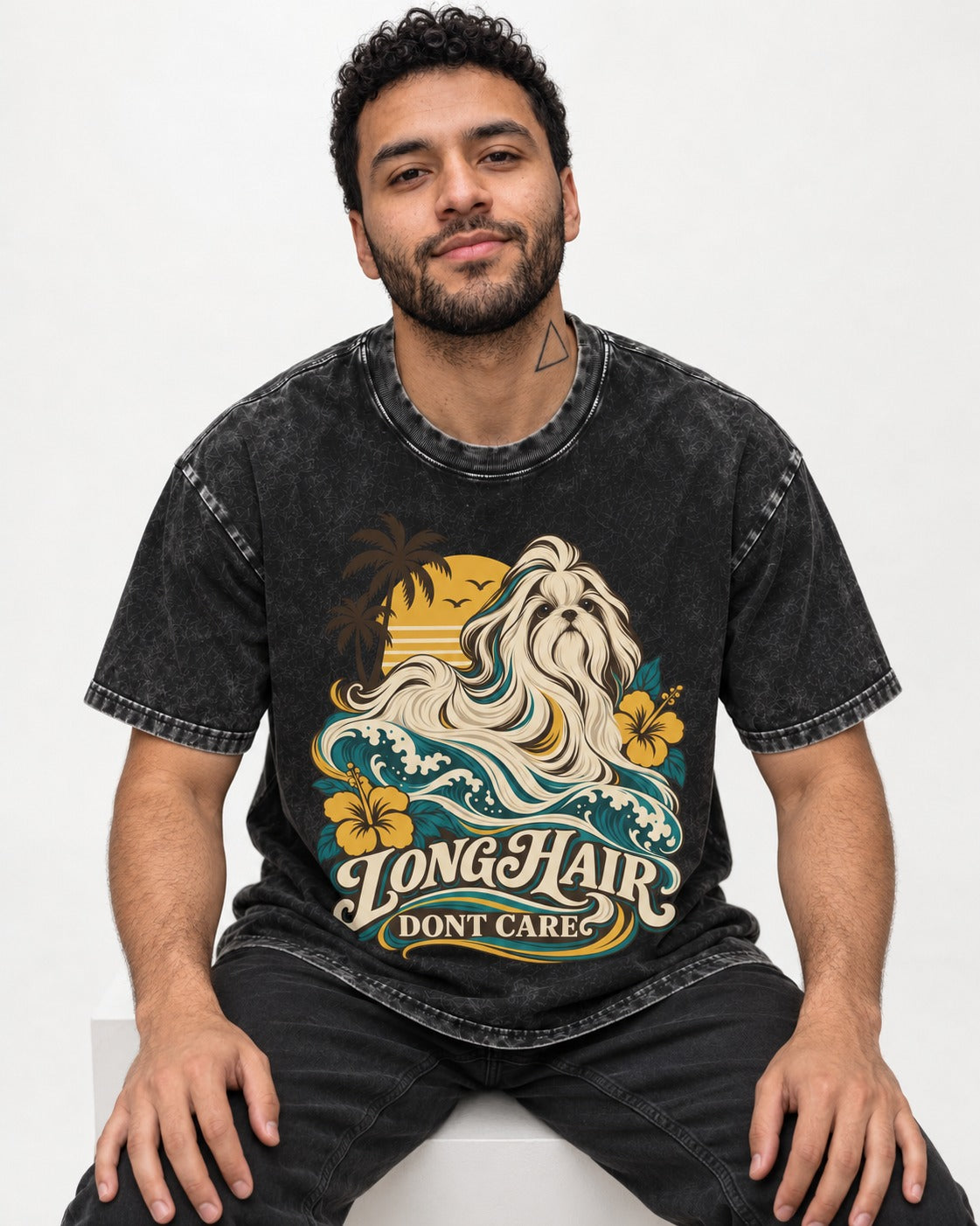 Shih Tzu Long Hair Don't Care Tropical Wave Graphic Washed Tee in Black, worn by a seated model