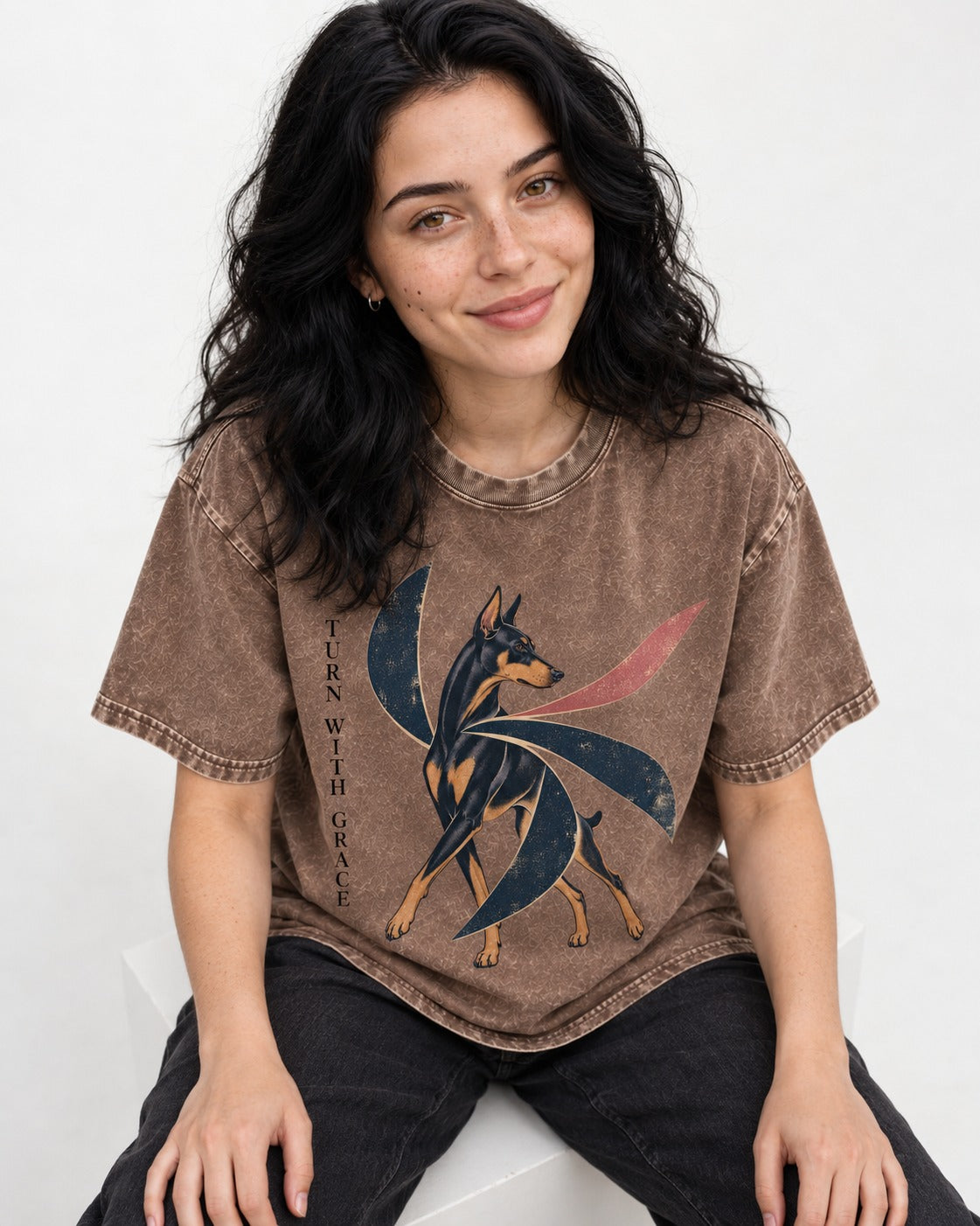 Turn with Doberman Grace Washed Tee in Coffee, worn by a seated model
