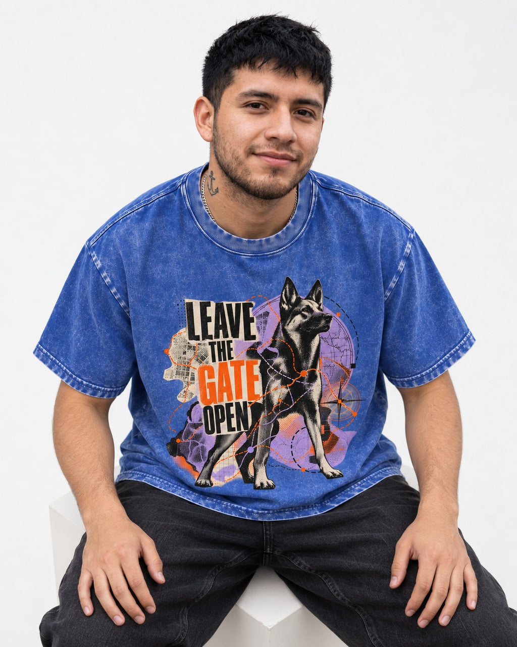 Leave The Gate Open Transit Collage German Shepherd Dog Graphic Washed Tee in Royal Blue, worn by a seated model