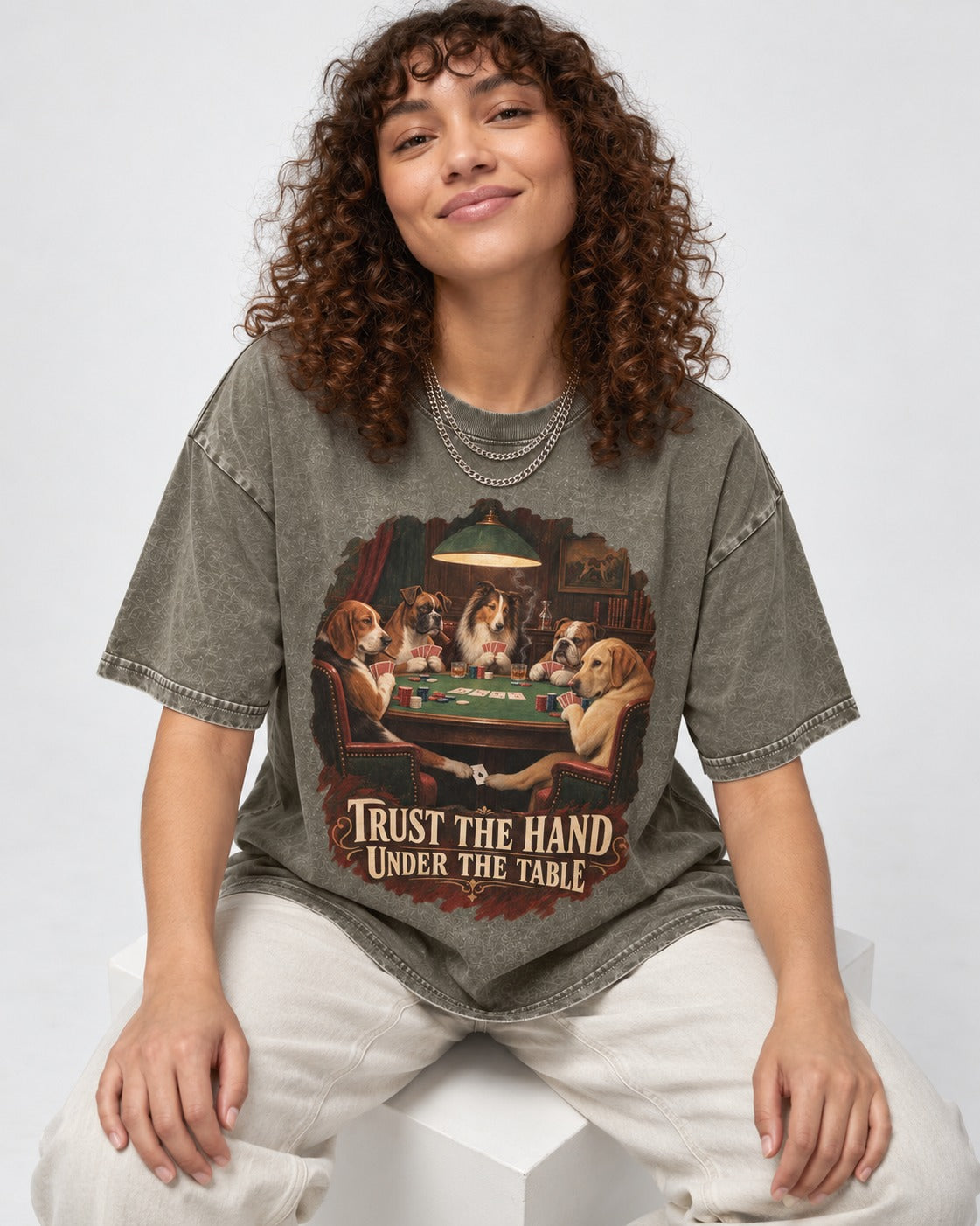 Labrador Retriever Trust the Hand Under the Table Poker Dogs Graphic Washed Tee in Army Green, worn by a seated model