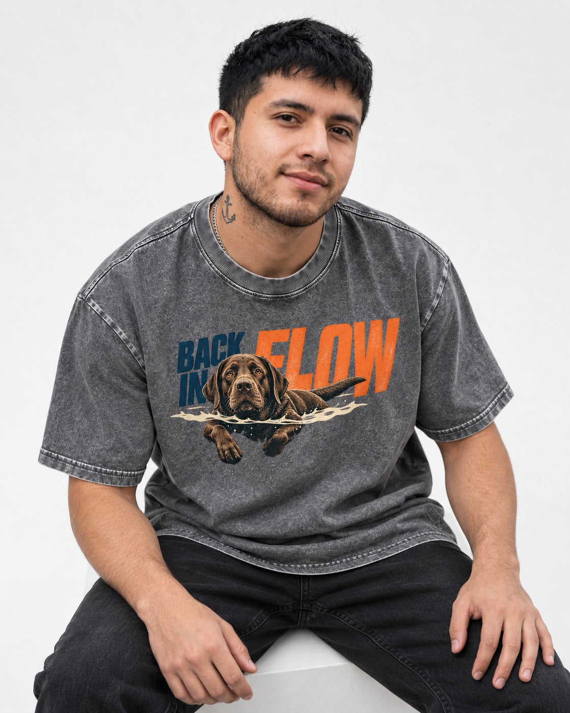 Labrador Retriever Back in Flow Washed Tee in Gray, worn by a seated model
