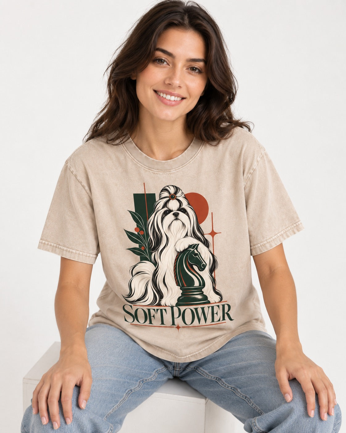 Soft Power Shih Tzu Washed Tee in Apricot, worn by a seated model