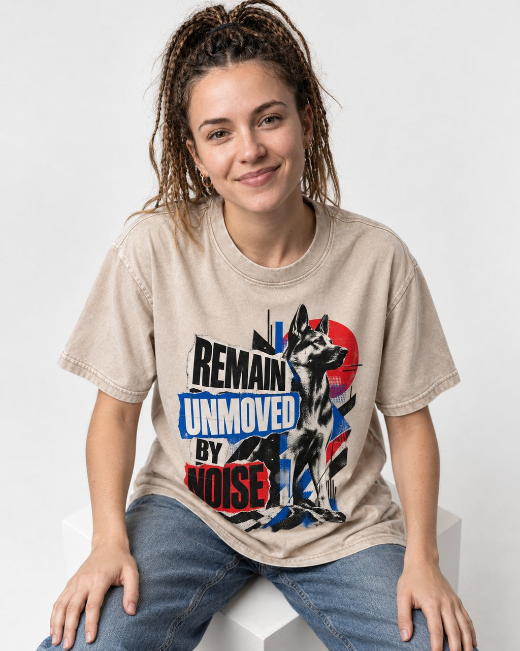 Remain Unmoved By Noise Brutalist Collage German Shepherd Dog Graphic Washed Tee in Apricot, worn by a seated model