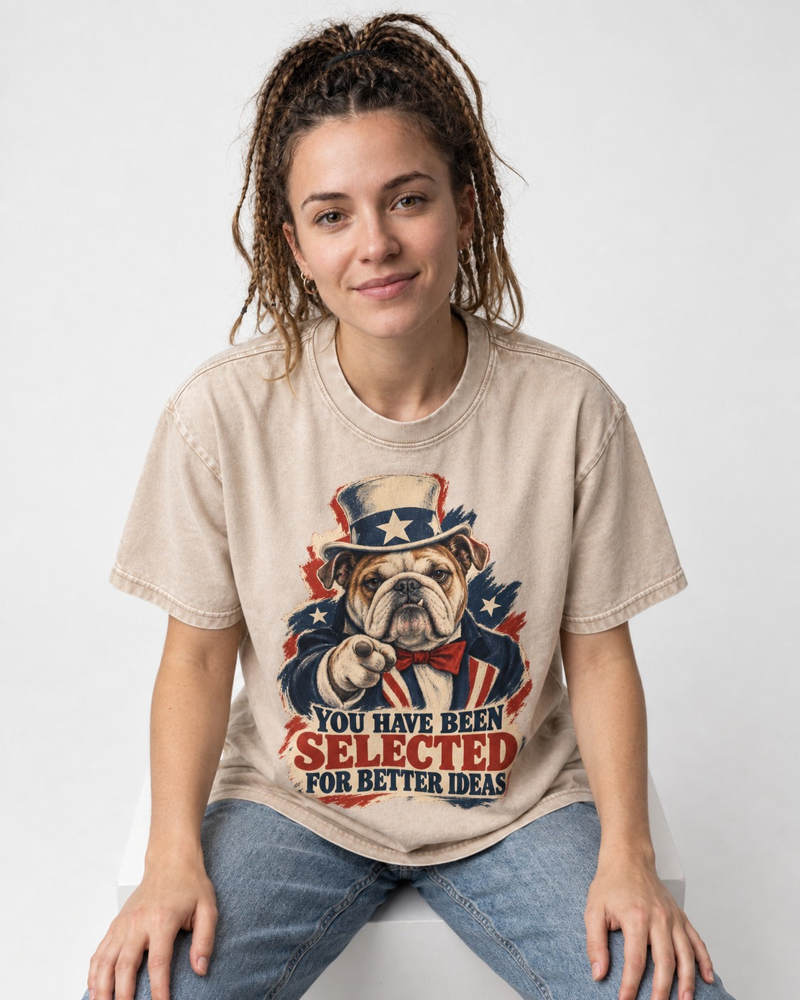 English Bulldog Selected for Better Ideas Washed Tee in Apricot, worn by a seated model