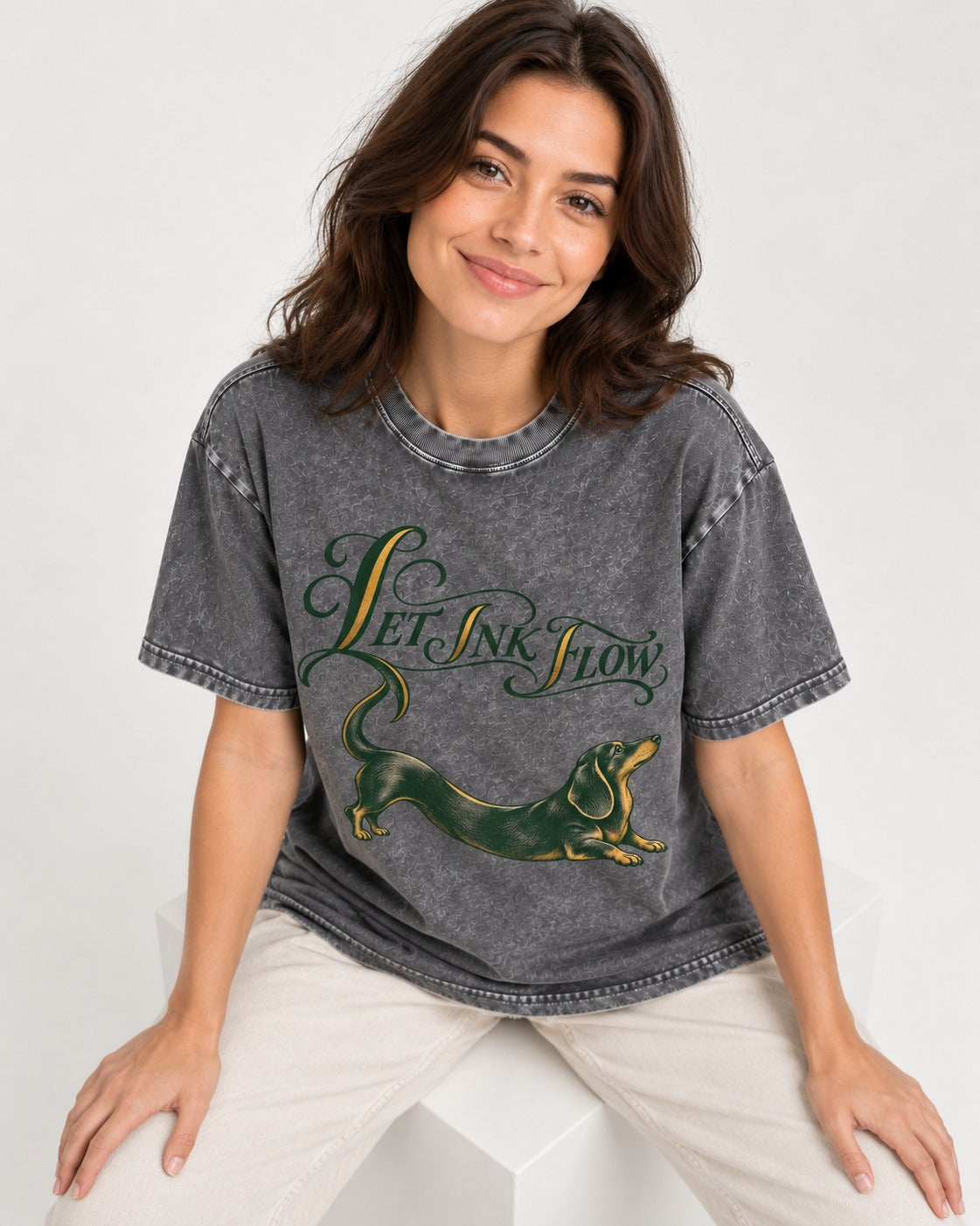 Let the Dachshund Ink Flow Washed Tee in Gray, worn by a seated model