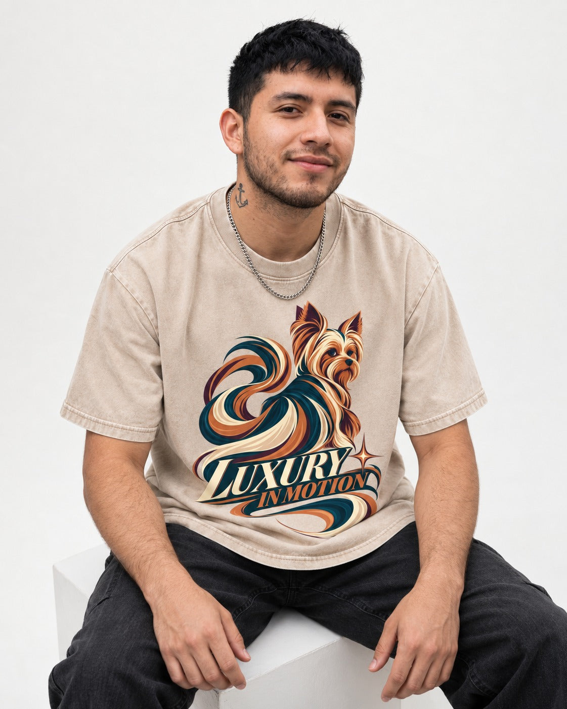 Yorkshire Terrier Luxury in Motion Washed Tee in Apricot, worn by a seated model
