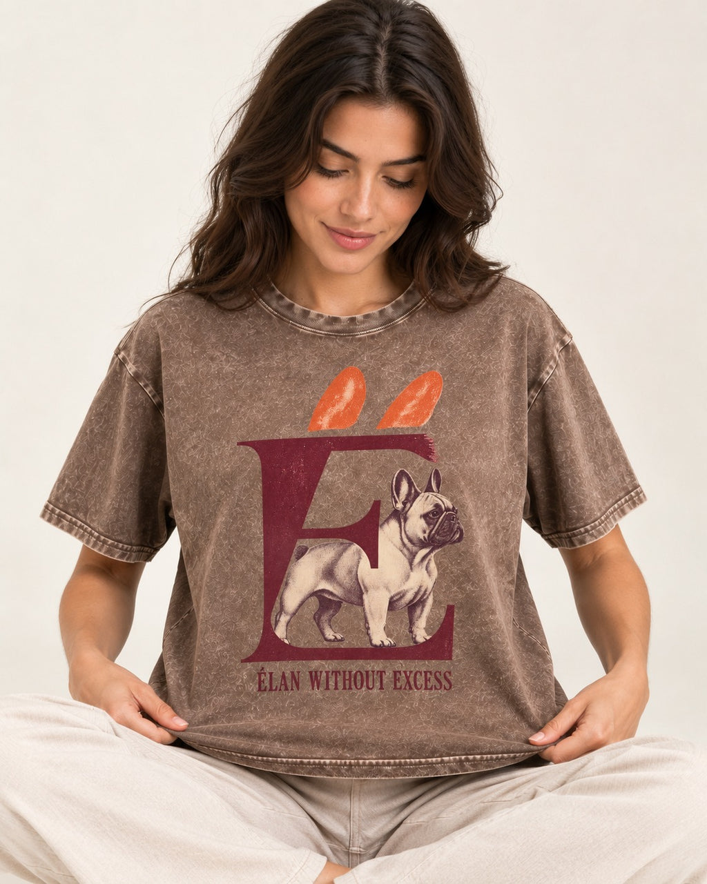 Frenchie Without Excess Washed Tee in Coffee, worn by a seated model