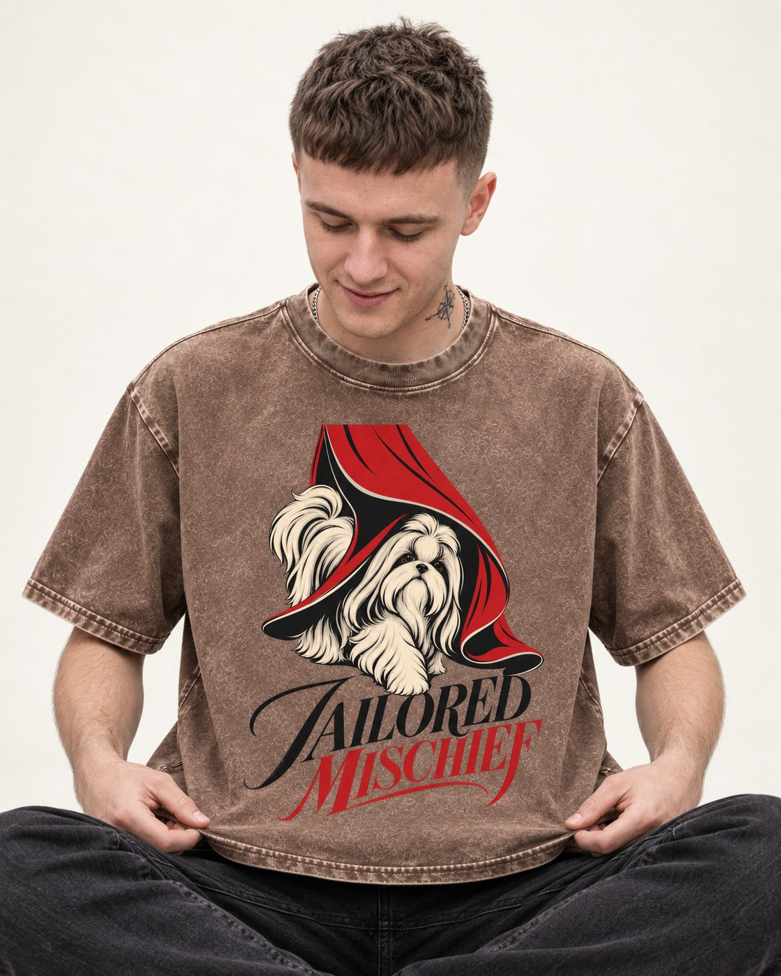 Tailored Mischief Shih Tzu Washed Tee in Coffee, worn by a seated model