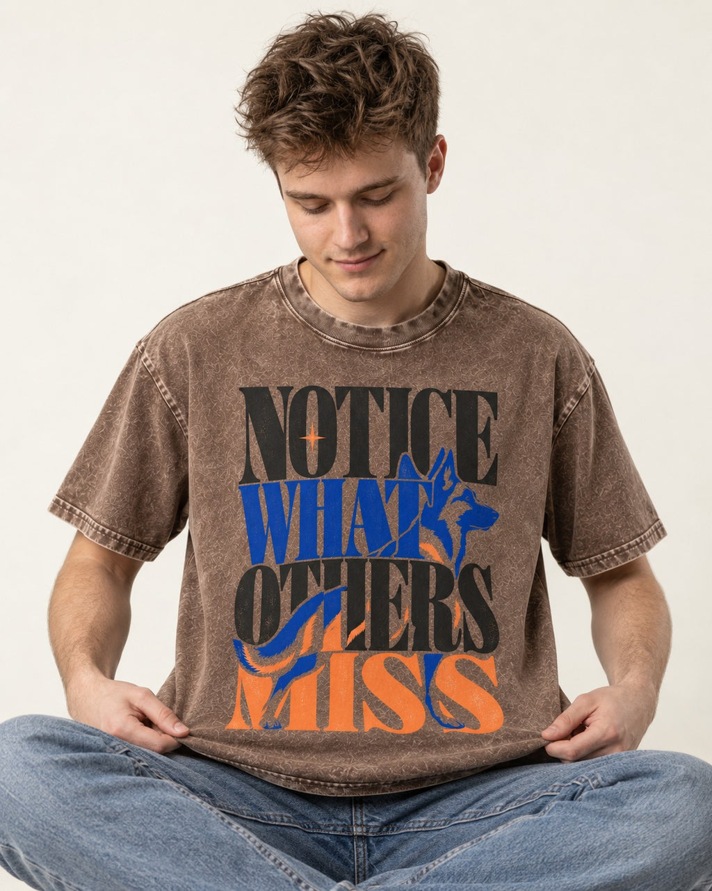 Notice What Others Miss German Shepherd Dog Washed Tee in Coffee, worn by a seated model