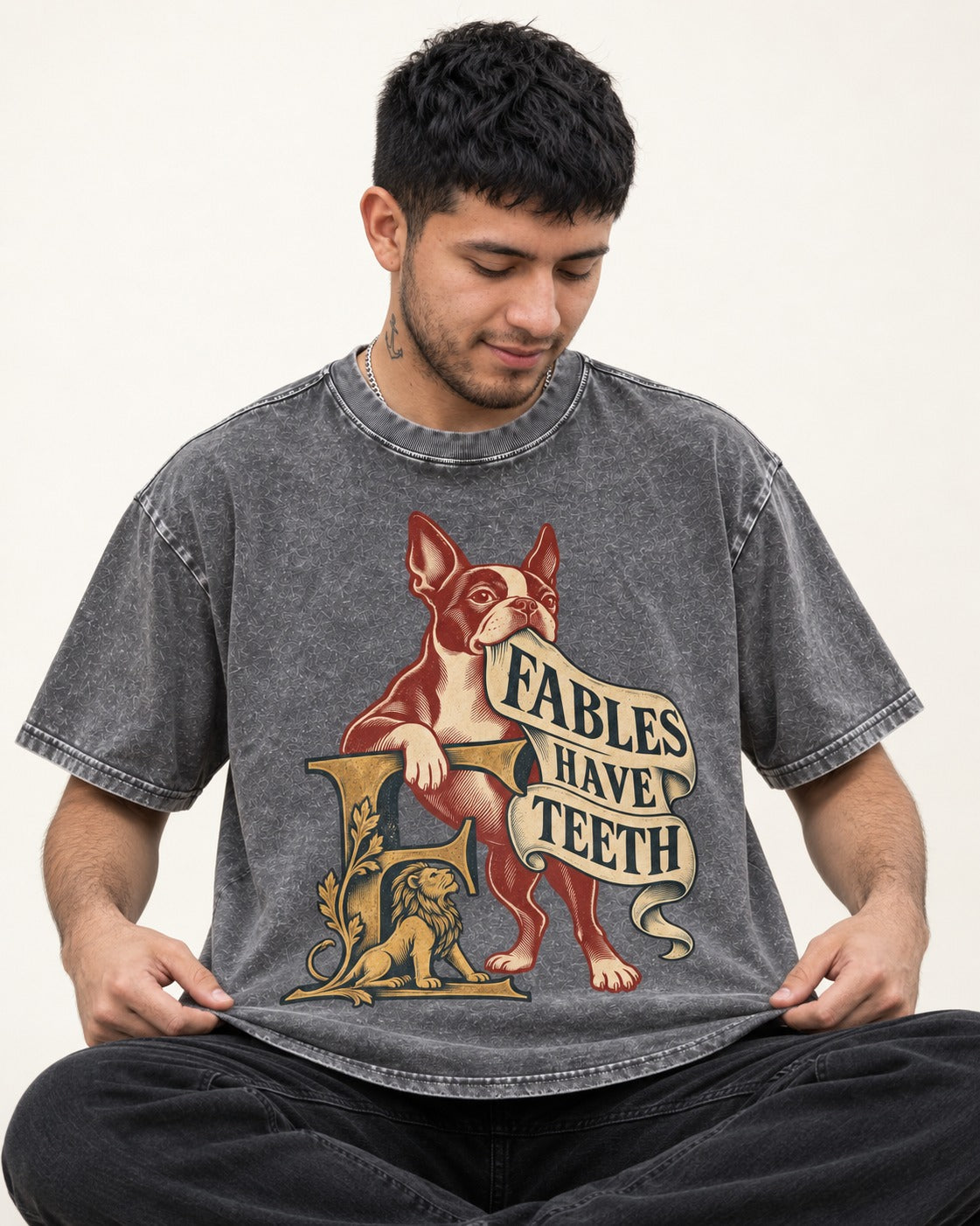 Boston Terrier Fables Have Teeth Washed Tee in Gray, worn by a seated model
