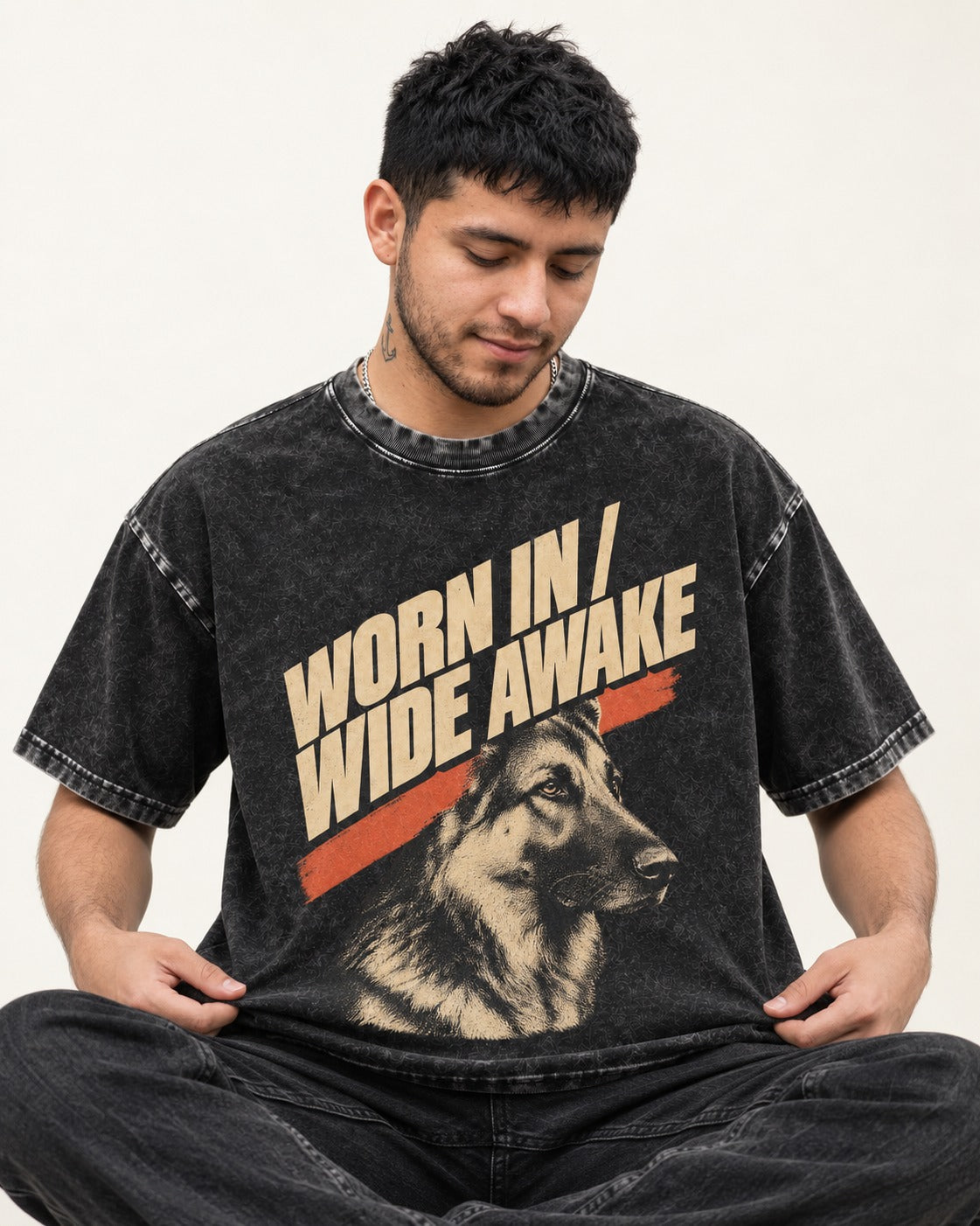 Worn In Wide Awake Portrait German Shepherd Dog Graphic Washed Tee in Black, worn by a seated model