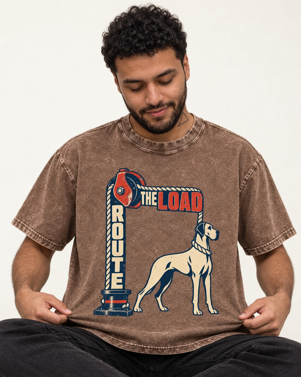 Great Dane Route the Load Washed Tee in Coffee, worn by a seated model