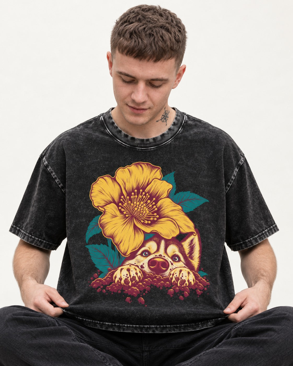 Husky Flower Witness Peeking Floral Graphic Washed Tee in Black, worn by a seated model