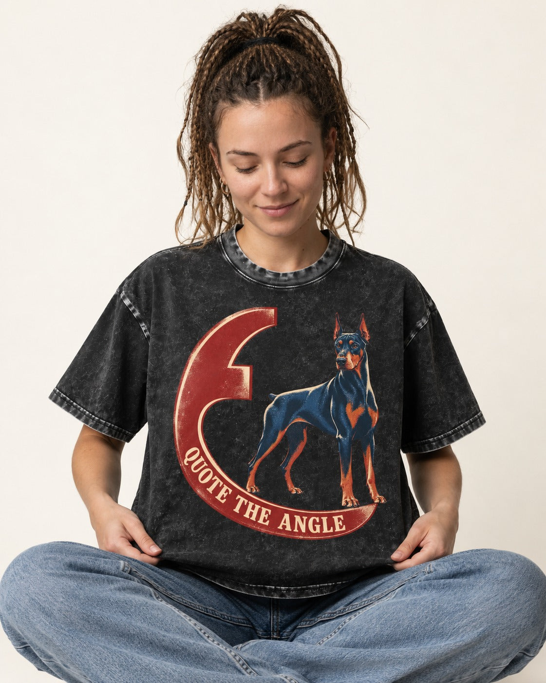 Doberman Quote the Angle Crescent Graphic Washed Tee in Black, worn by a seated model