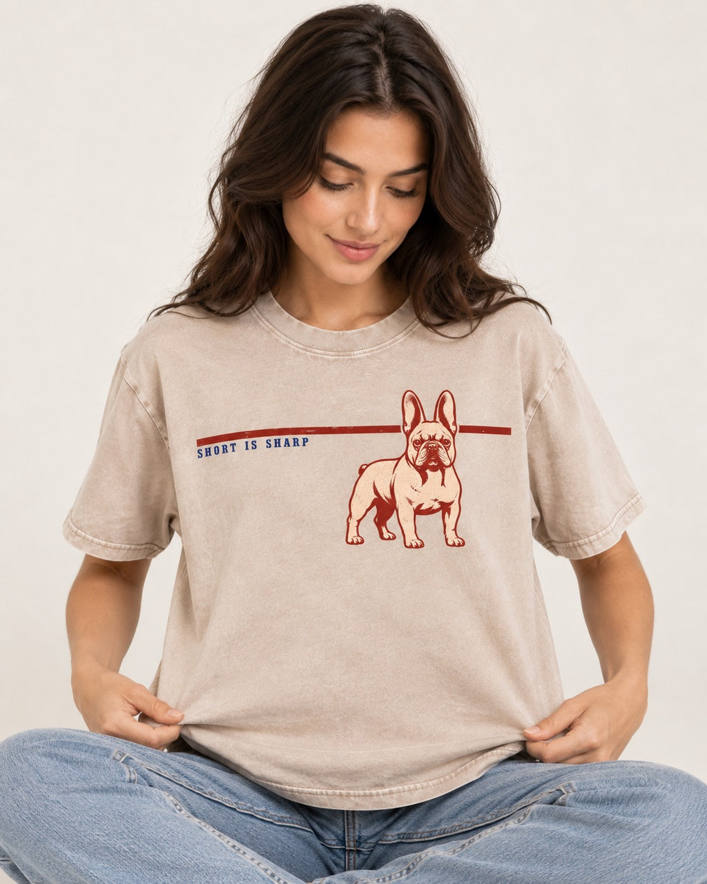 Short Is Sharp Frenchie Washed Tee in Apricot, worn by a seated model