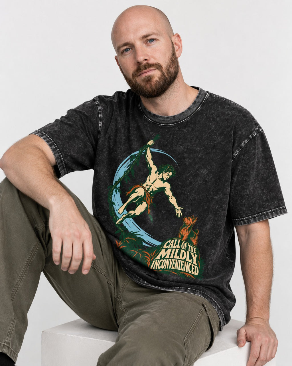 Yorkshire Terrier Call of the Mildly Inconvenienced Vine Swing Graphic Washed Tee in Black, worn by a seated model