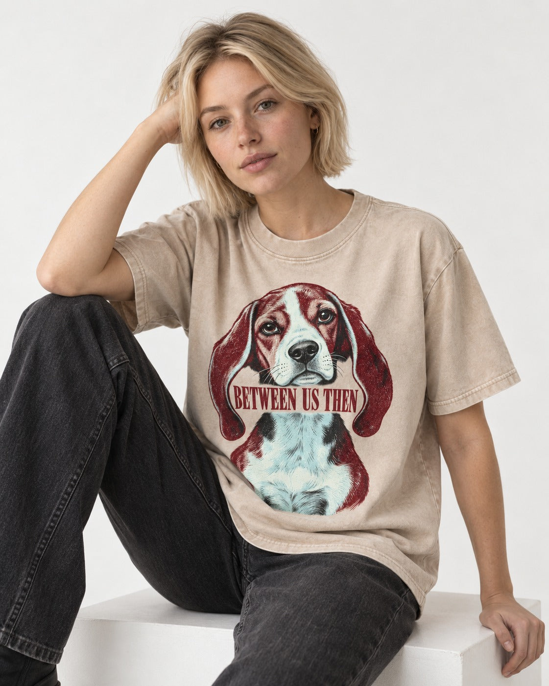Beagle Between Us Then Washed Tee in Apricot, worn by a seated model