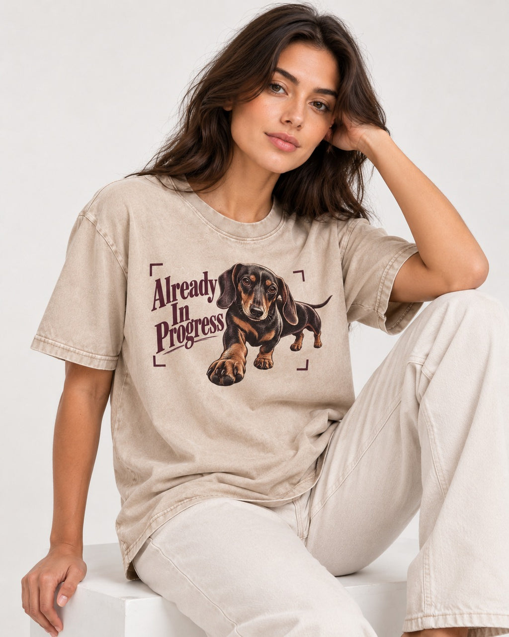 Dachshund Already in Progress Washed Tee in Apricot, worn by a seated model