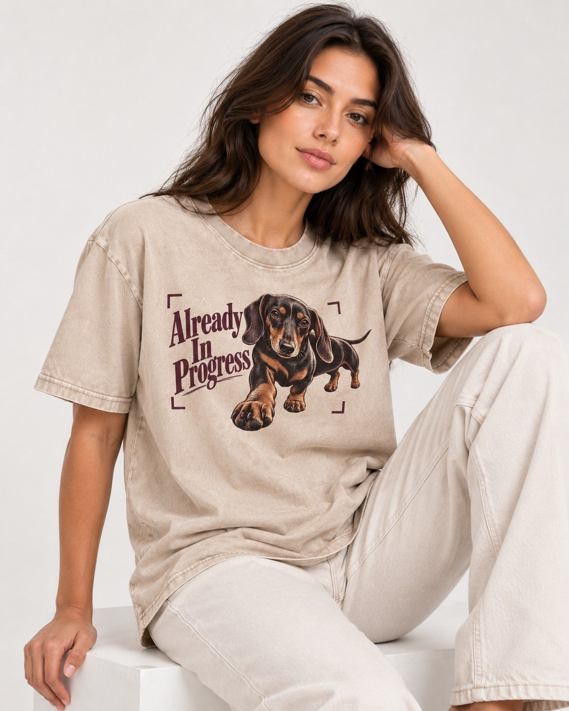Dachshund Already in Progress Washed Tee in Apricot, worn by a seated model