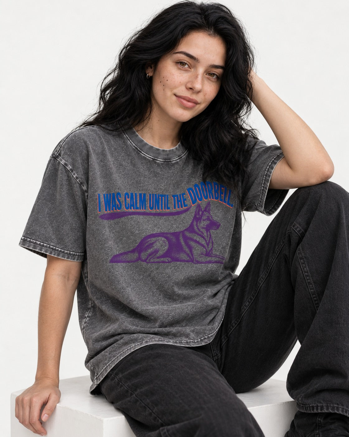 German Shepherd Dog Calm Until the Doorbell Washed Tee in Gray, worn by a seated model
