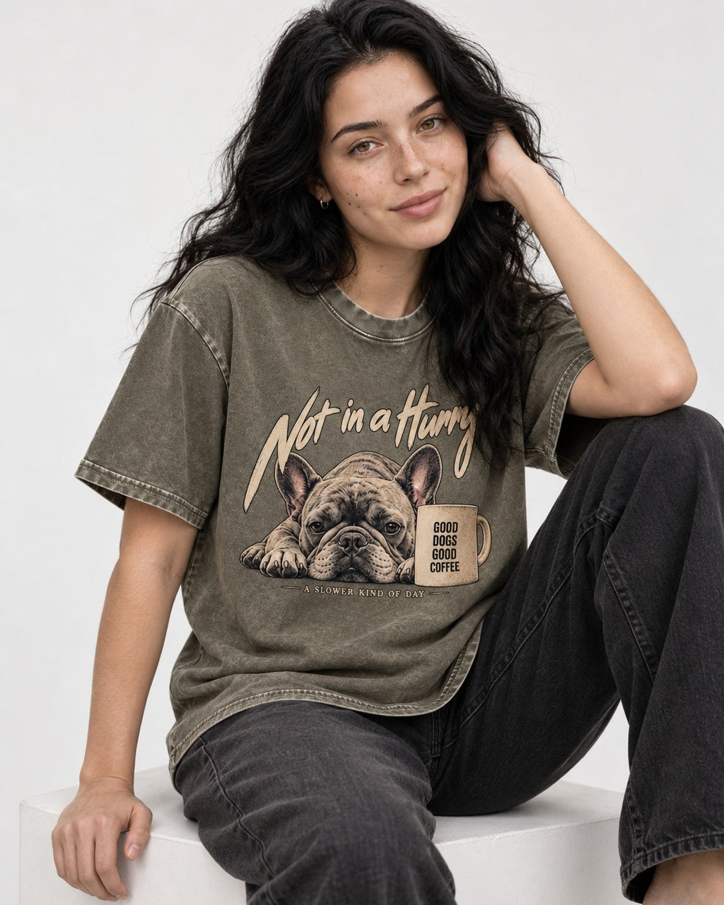 Frenchie Not in a Hurry Coffee Graphic Washed Tee in Army Green, worn by a seated model
