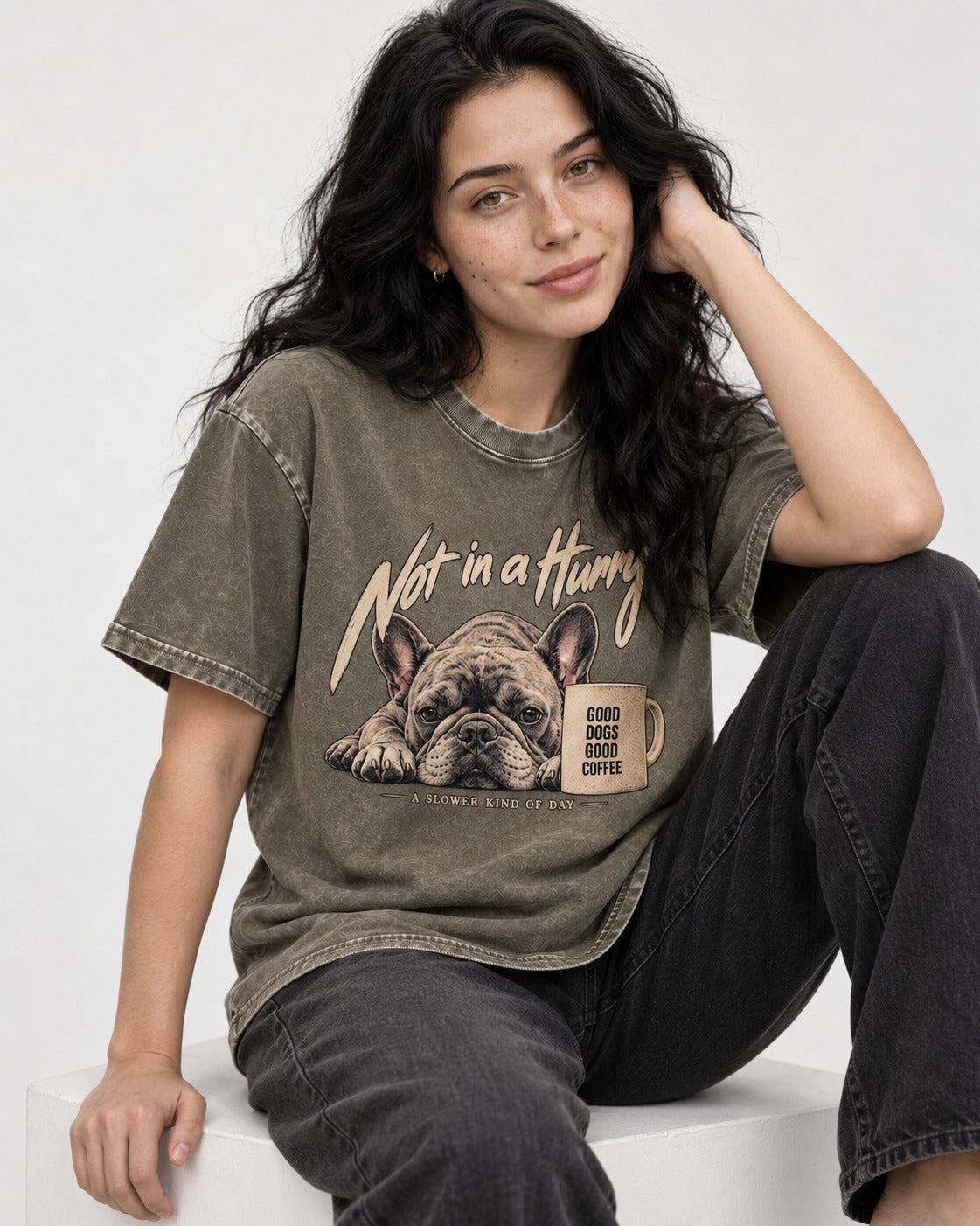 Frenchie Not in a Hurry Coffee Graphic Washed Tee in Army Green, worn by a seated model