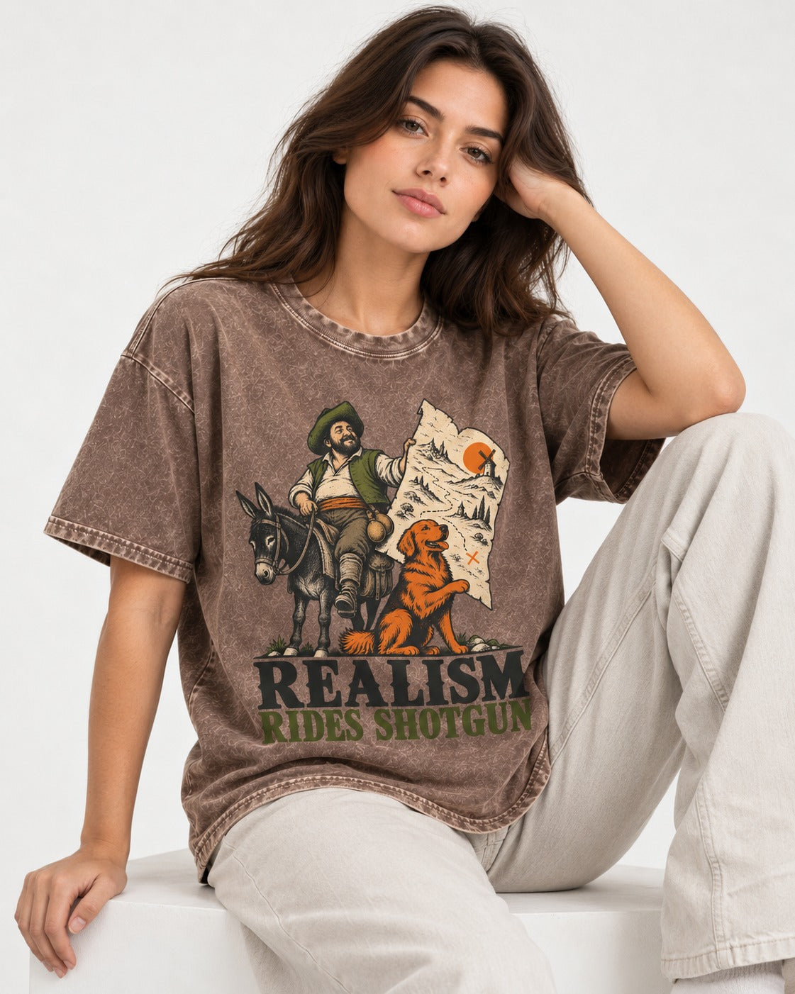Realism Rides Shotgun with Golden Retriever Washed Tee in Coffee, worn by a seated model