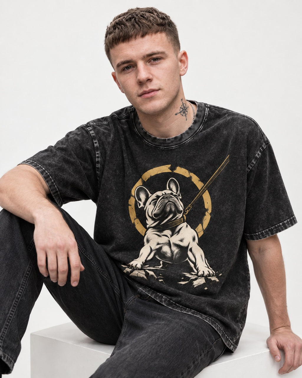 Frenchie Stubborn Leash Monument Graphic Washed Tee in Black, worn by a seated model