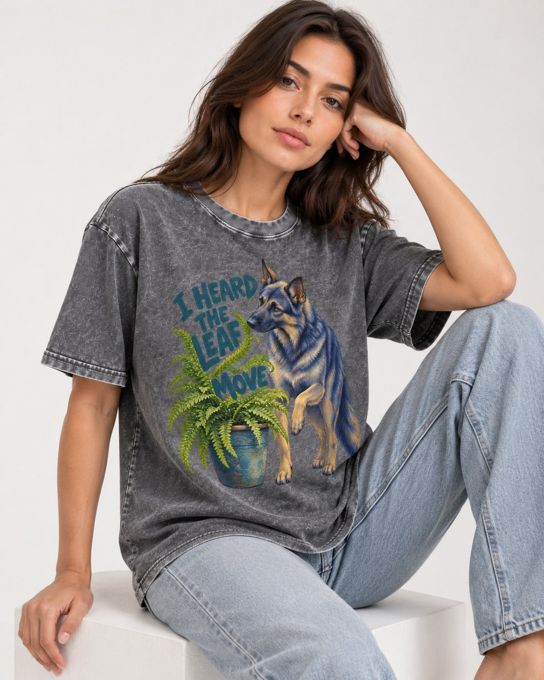 German Shepherd Dog Heard the Leaf Move Washed Tee in Gray, worn by a seated model