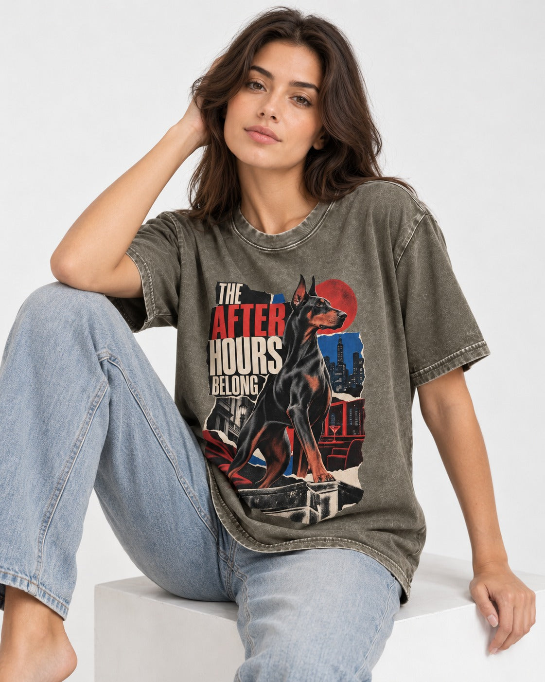 Doberman The After Hours Belong City Collage Washed Tee in Army Green, worn by a seated model