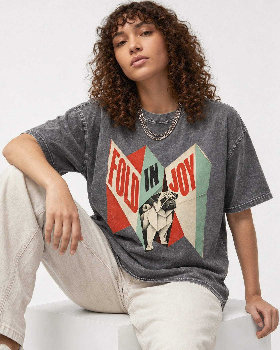 Pug Fold in Joy Geometric Poster Graphic Washed Tee in Gray, worn by a seated model
