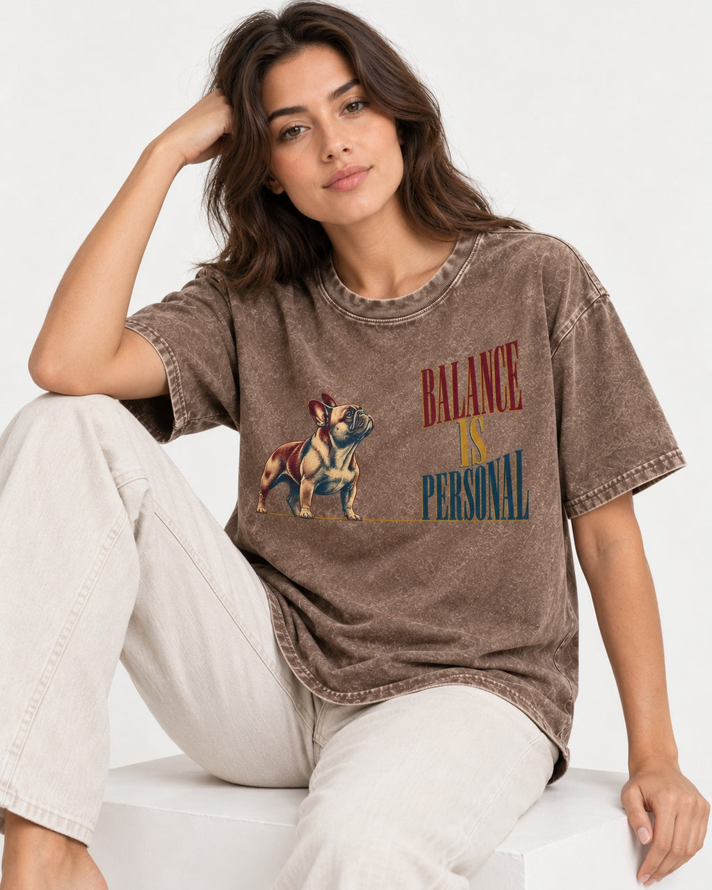 Frenchie Balance Is Personal Washed Tee in Coffee, worn by a seated model