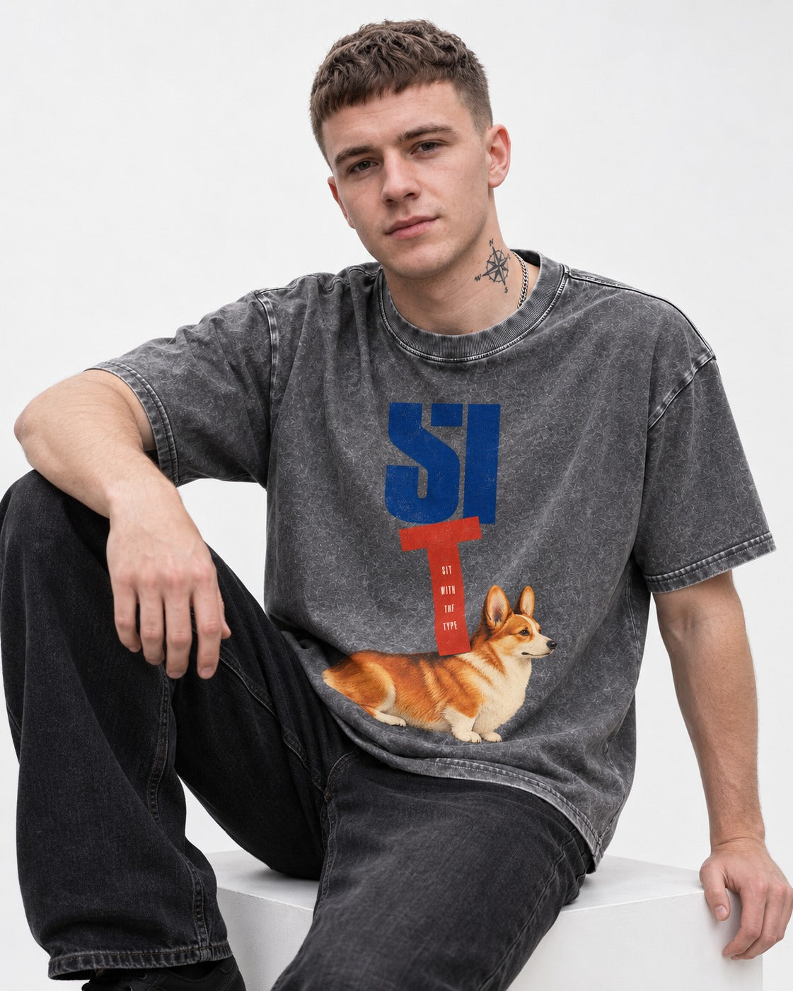 Sit with the Corgi Washed Tee in Gray, worn by a seated model