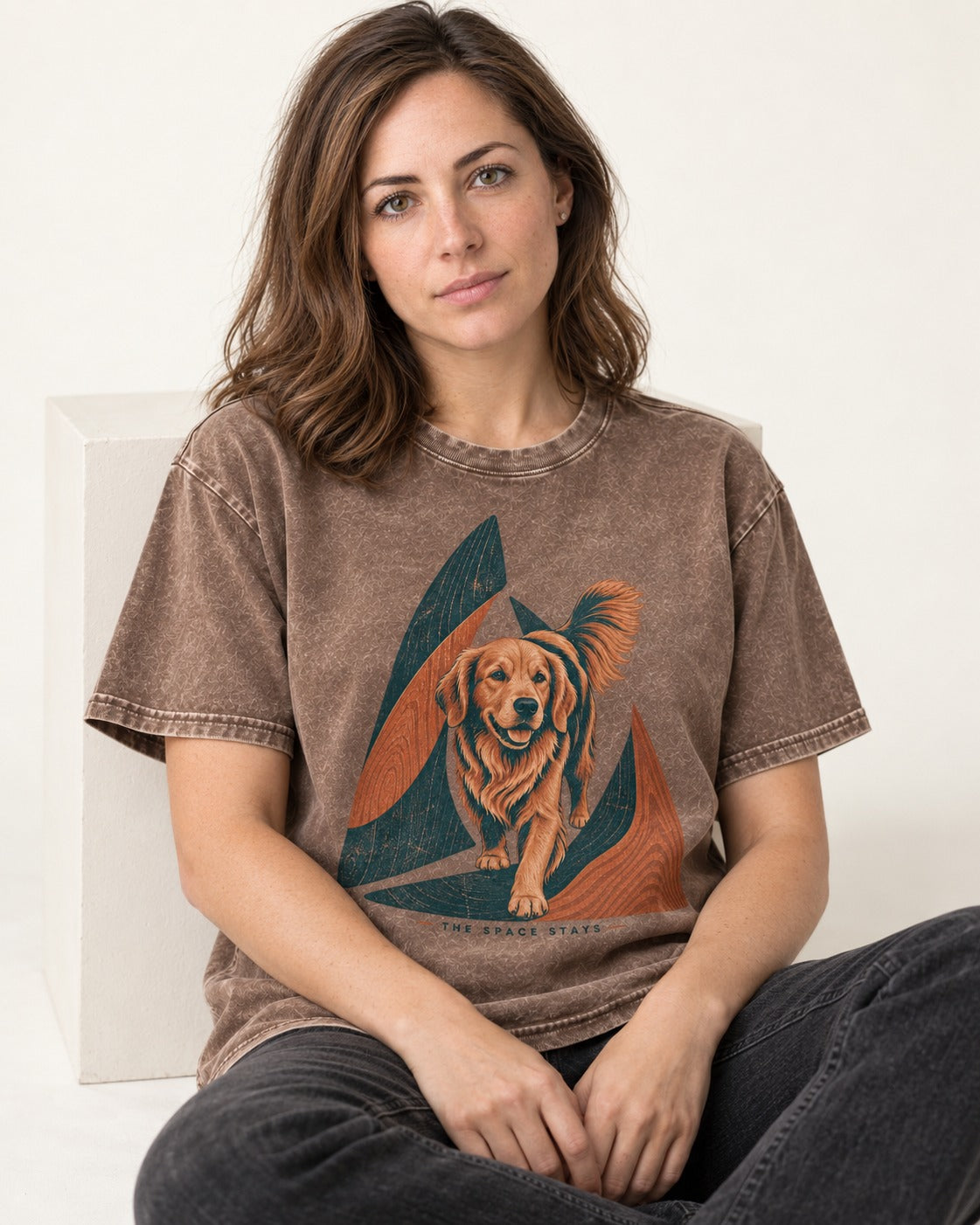 The Golden Retriever Space Stays Washed Tee in Coffee, worn by a seated model