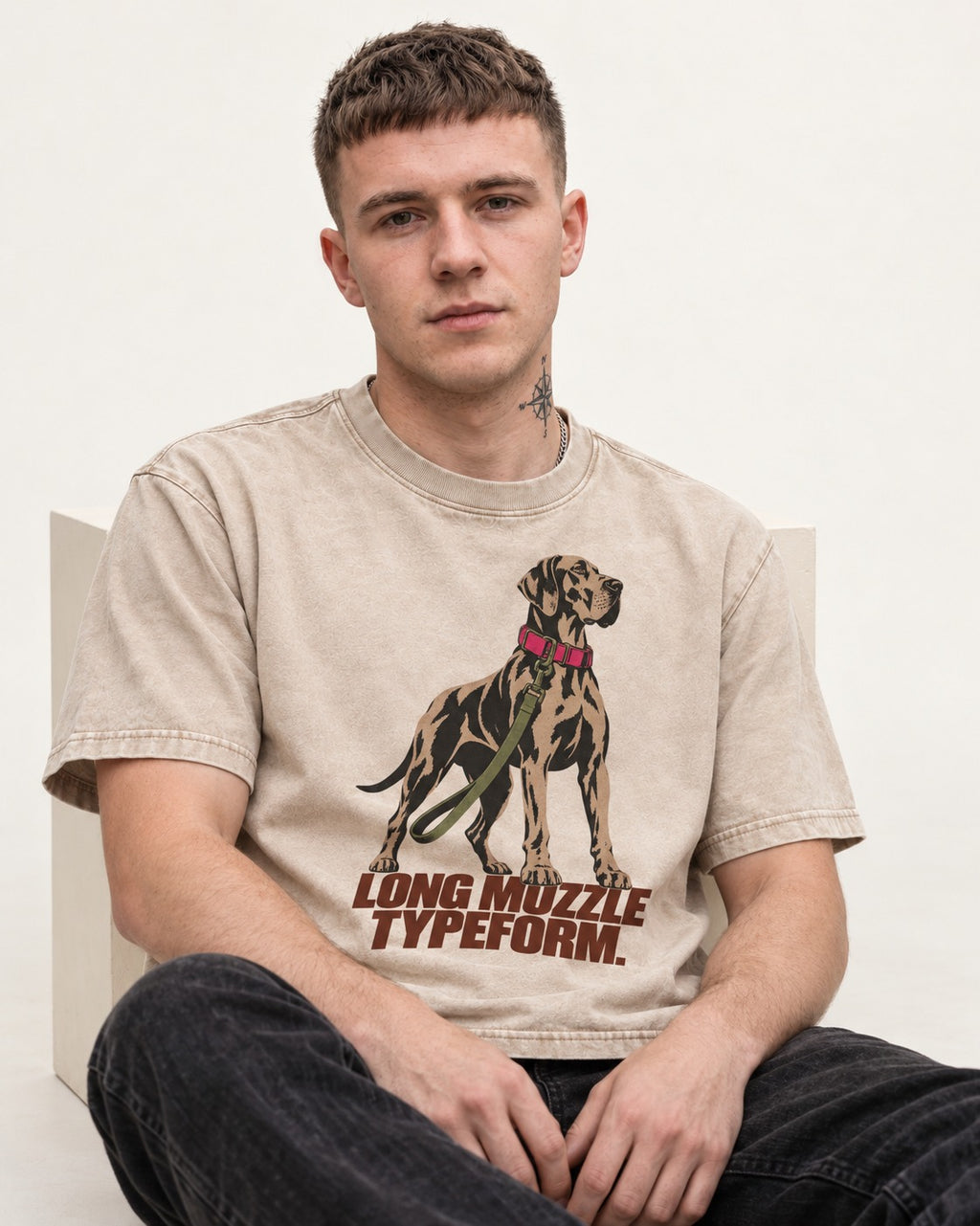 Long Muzzle Typeform Great Dane Washed Tee in Apricot, worn by a seated model