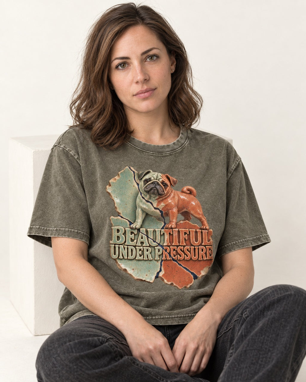 Pug Beautiful Under Pressure Cracked Ceramic Graphic Washed Tee in Army Green, worn by a seated model