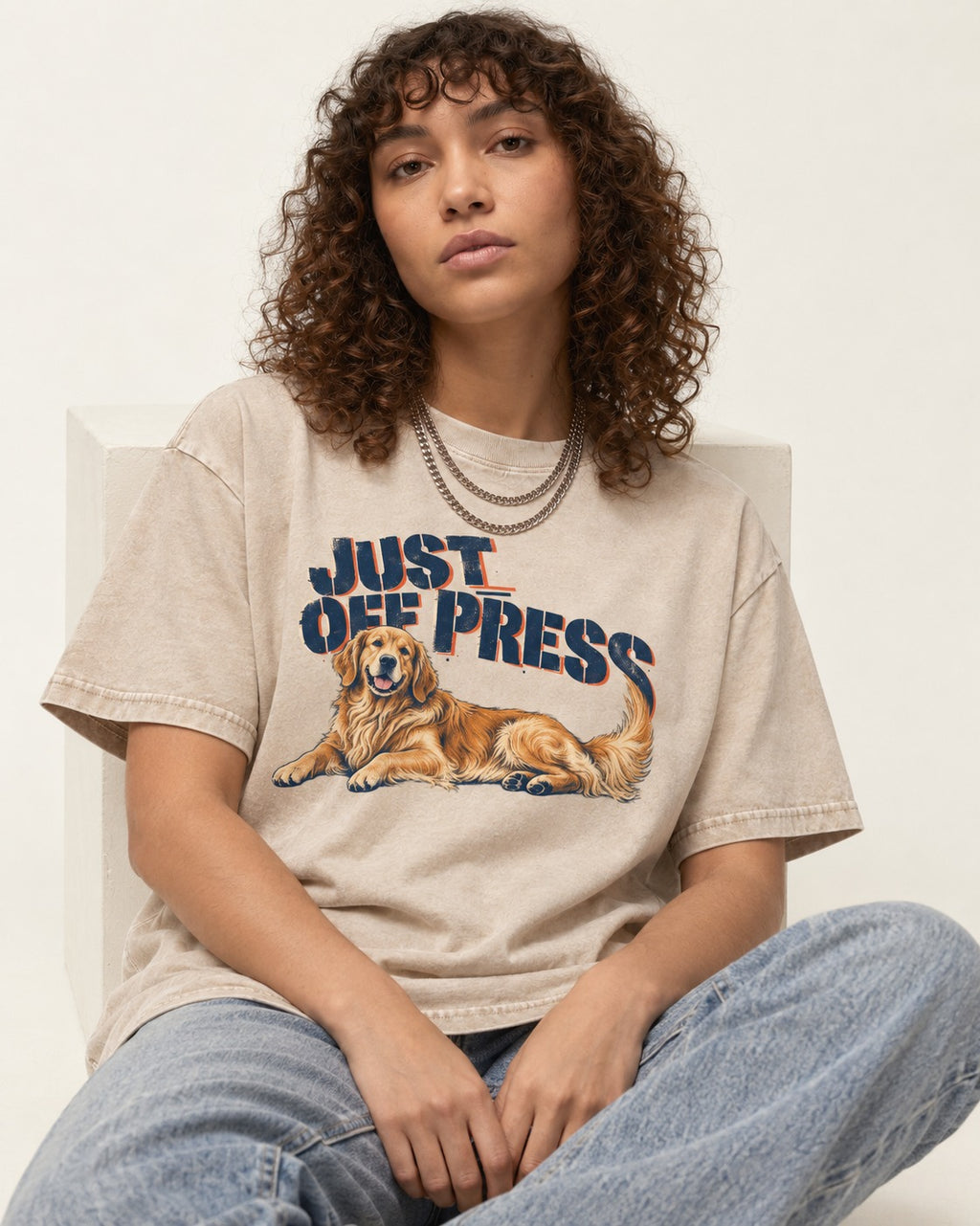 Golden Retriever Just Off Press Washed Tee in Apricot, worn by a seated model