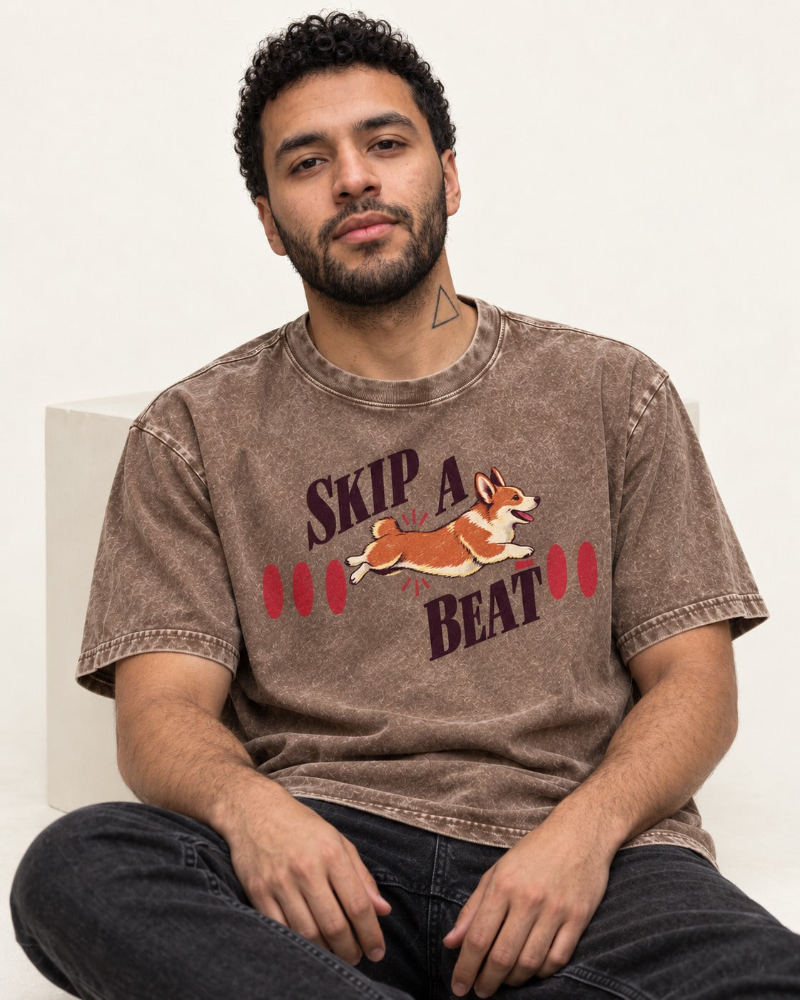 Skip a Beat Corgi Washed Tee in Coffee, worn by a seated model