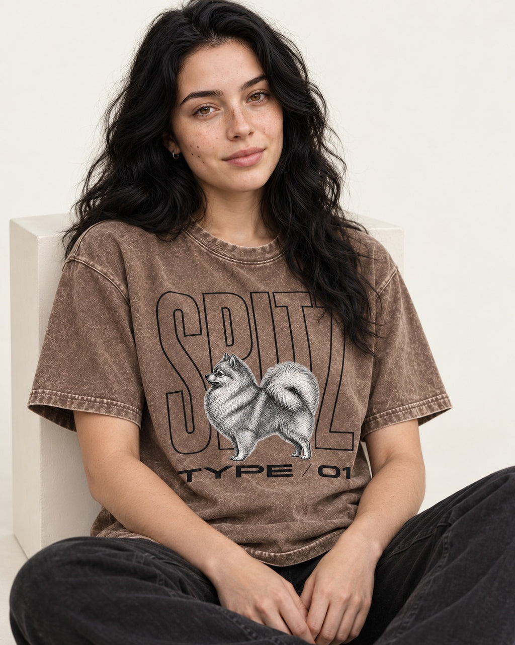 Pomeranian Spitz Washed Tee in Coffee, worn by a seated model