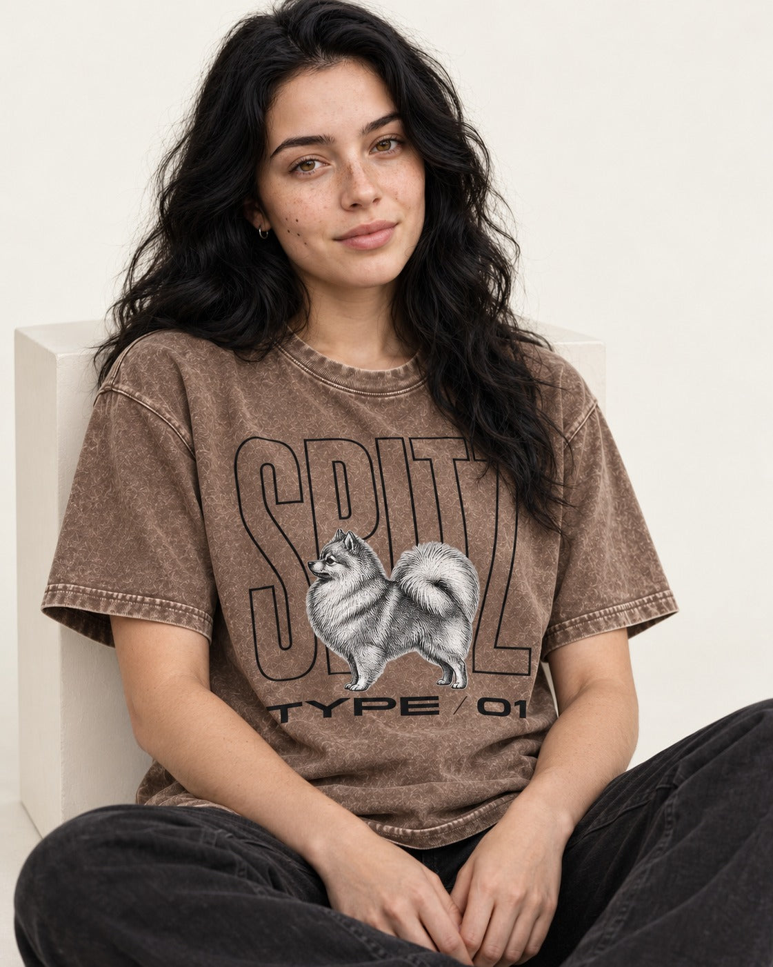 Pomeranian Spitz Washed Tee in Coffee, worn by a seated model