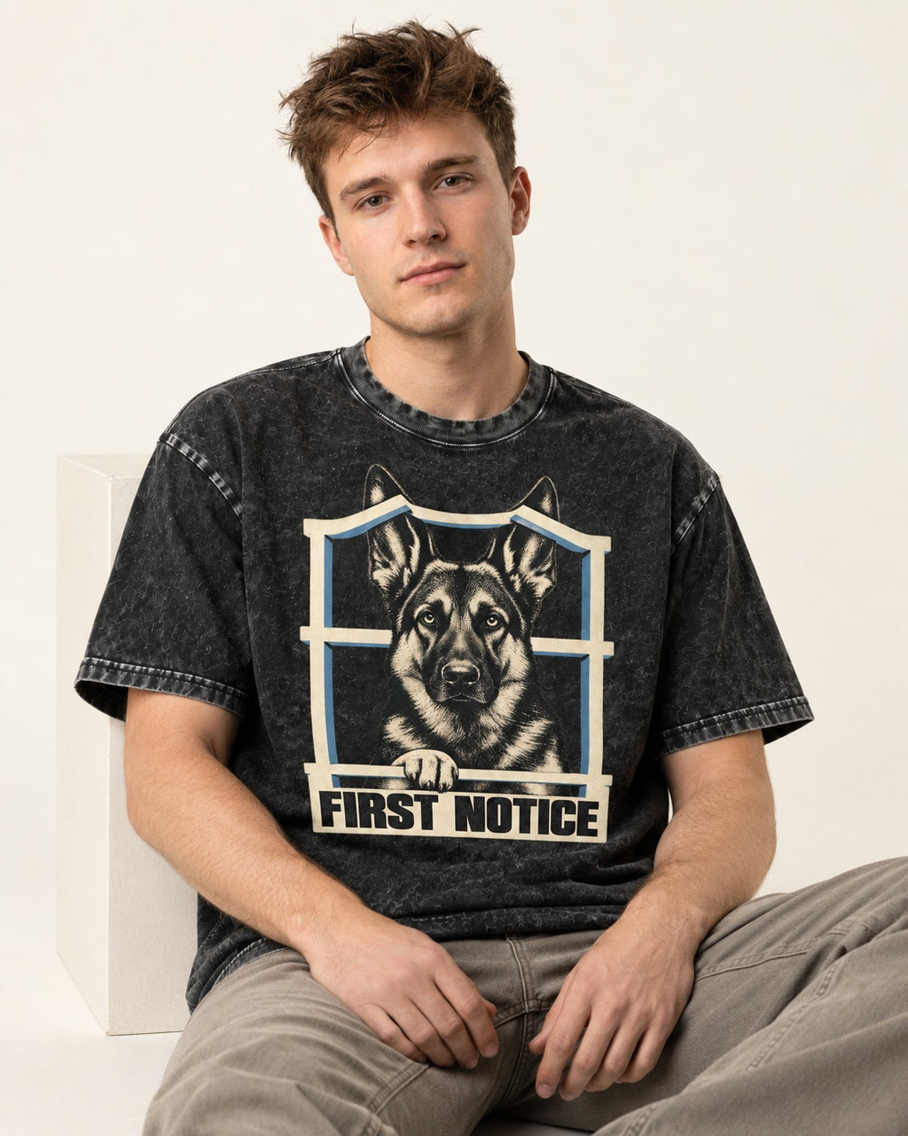 First Notice Window German Shepherd Dog Graphic Washed Tee in Black, worn by a seated model
