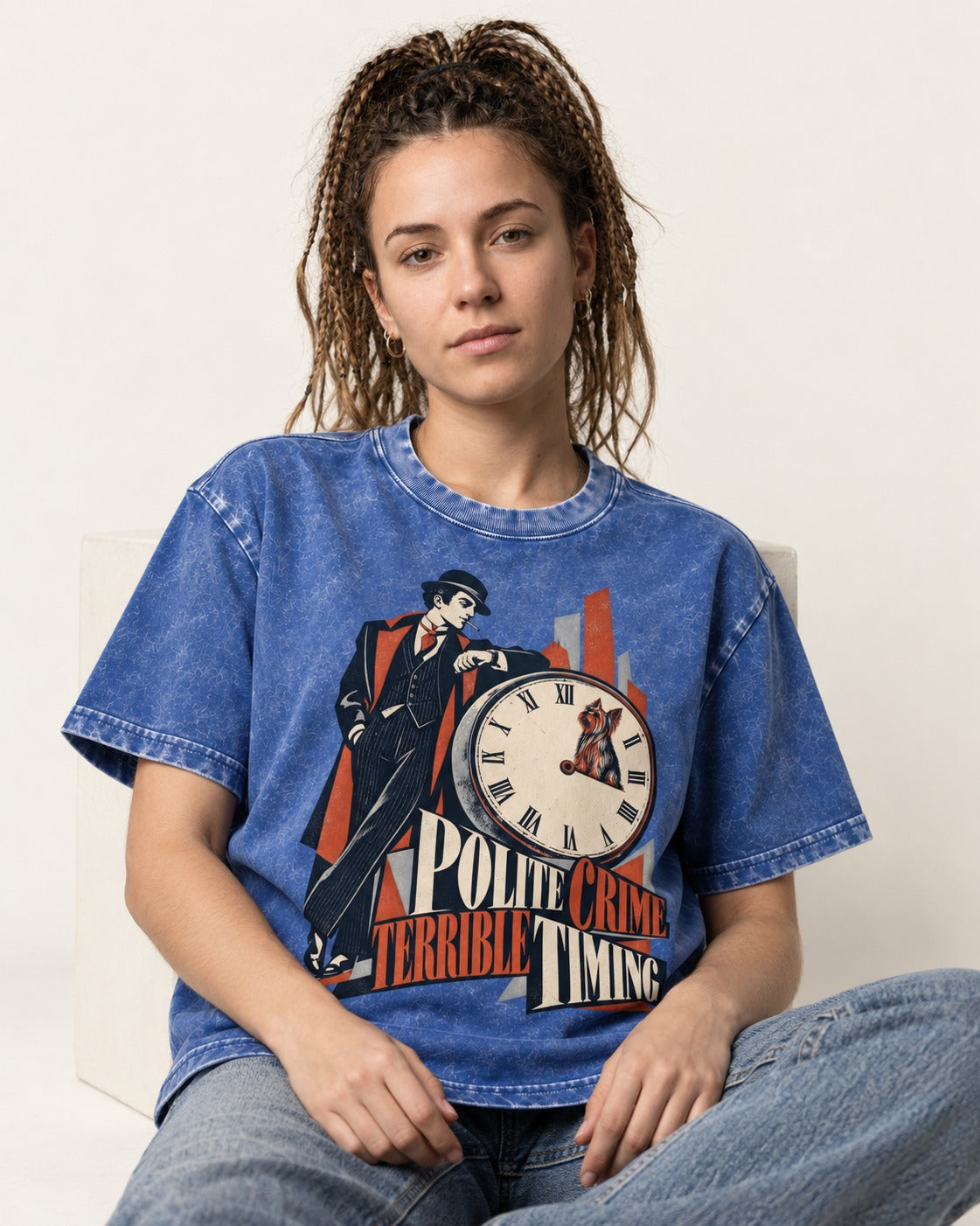 Yorkshire Terrier Polite Crime Terrible Timing Art Deco Clock Graphic Washed Tee in Royal Blue, worn by a seated model