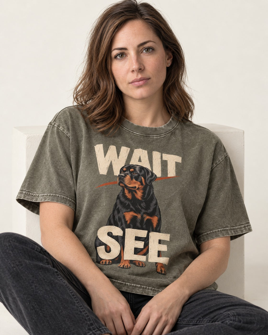 Wait See Rottweiler Seated Slash Graphic Washed Tee in Army Green, worn by a seated model