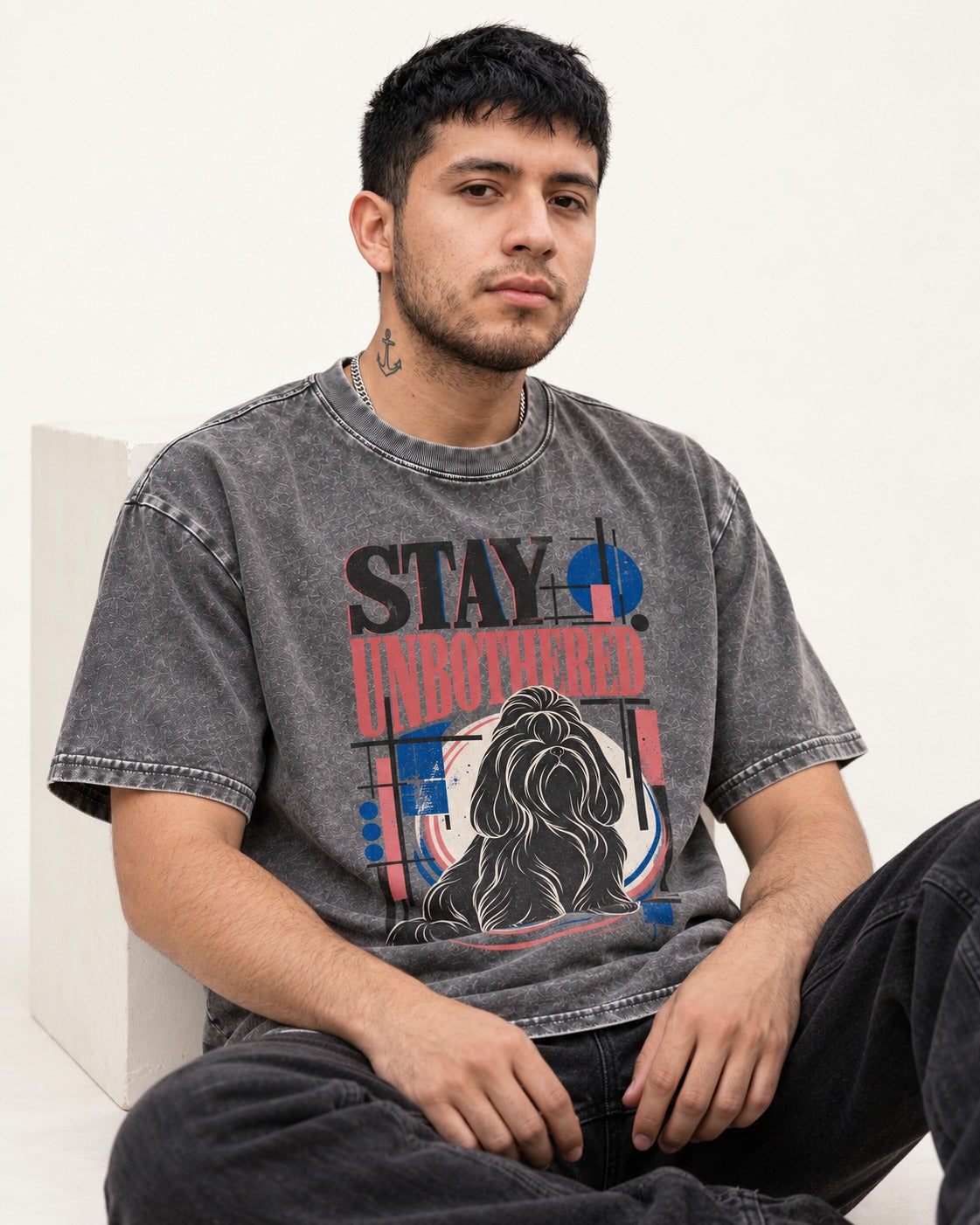 Stay Unbothered Shih Tzu Washed Tee in Gray, worn by a seated model