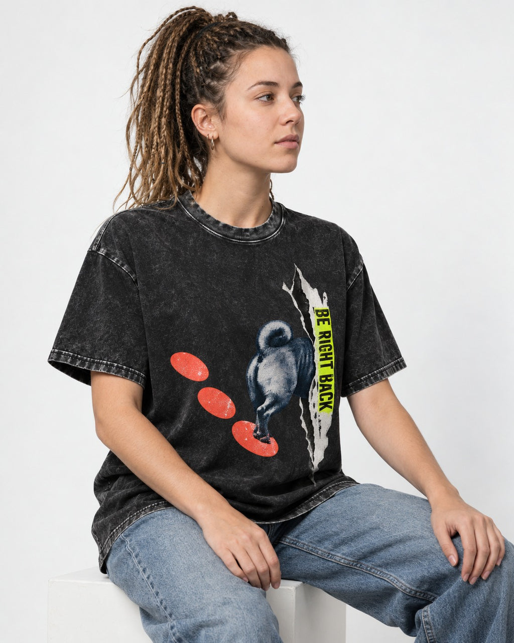 Pug Be Right Back Torn Portal Graphic Washed Tee in Black, worn by a seated model