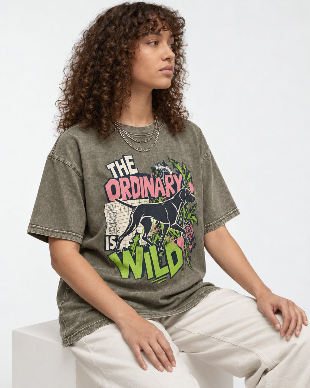 German Shorthaired Pointer The Ordinary Is Wild Grocery List Graphic Washed Tee in Army Green, worn by a seated model