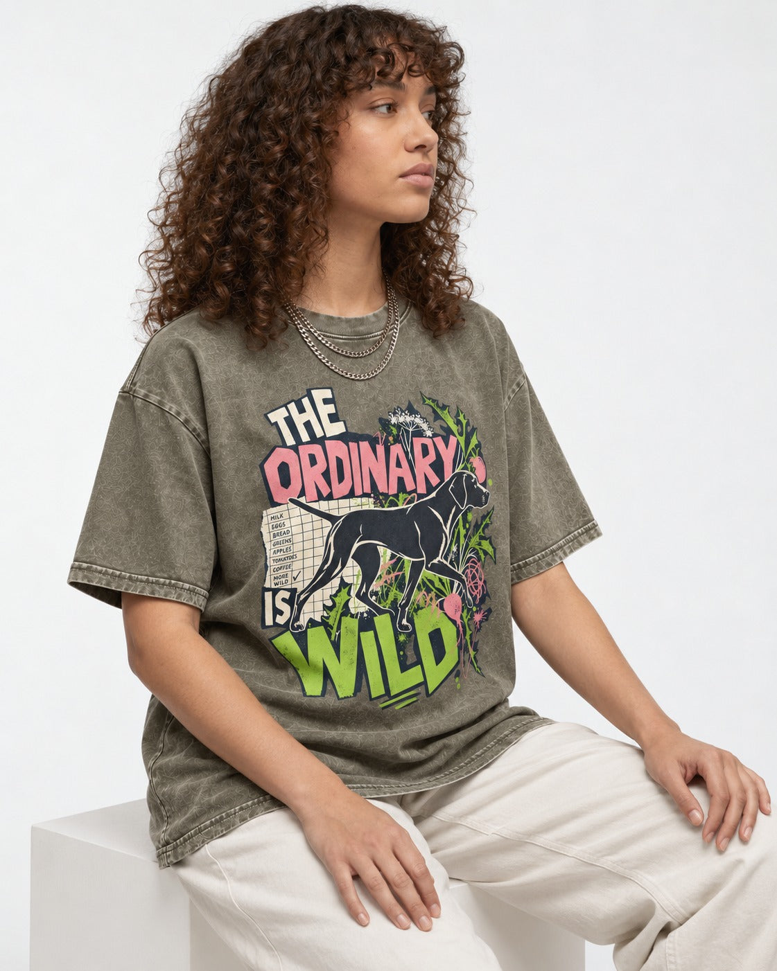 German Shorthaired Pointer The Ordinary Is Wild Grocery List Graphic Washed Tee in Army Green, worn by a seated model