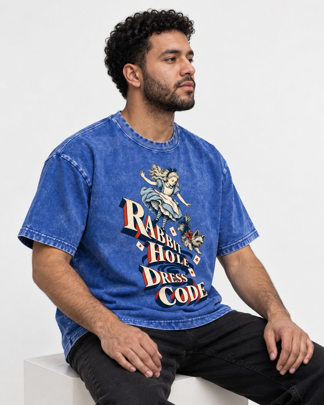 Yorkshire Terrier Rabbit Hole Dress Code Wonderland Graphic Washed Tee in Royal Blue, worn by a seated model